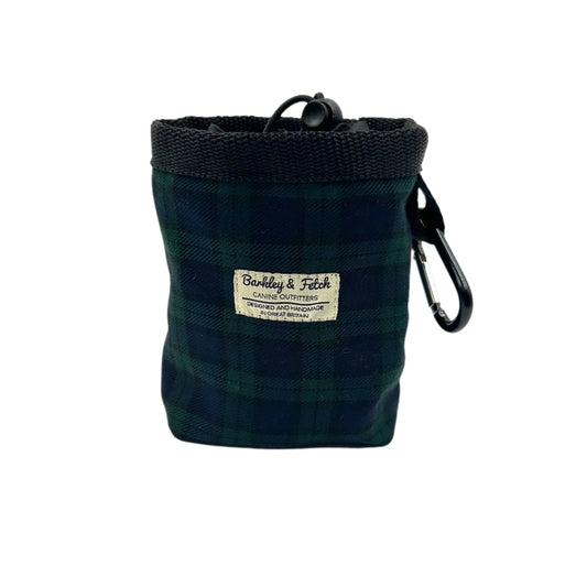 Green plaid chalk bag with a carabiner on a white background