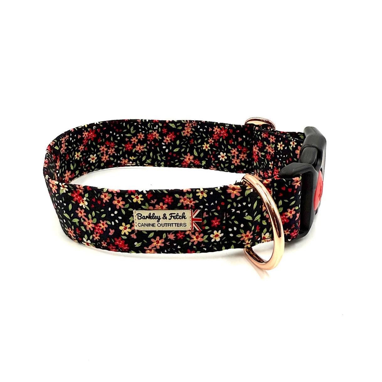 Floral patterned dog collar with a gold ring on a white background